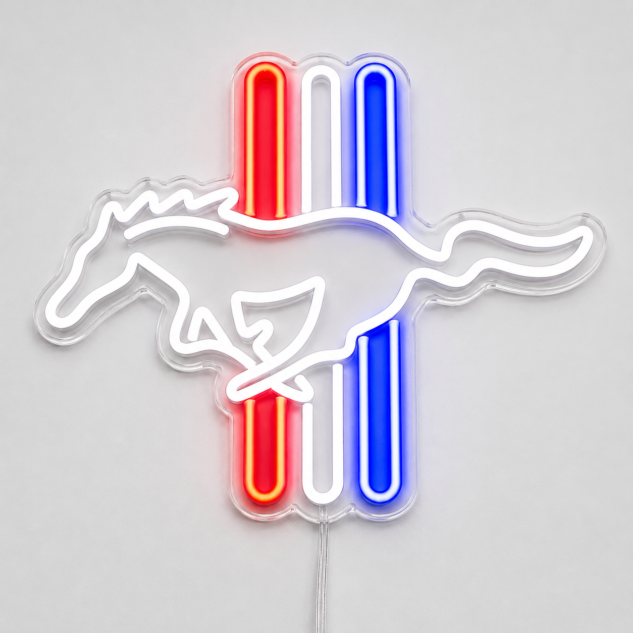 A neon-style Mustang logo sign with a white running horse outline over vertical red, white, and blue stripes on a light gray background.