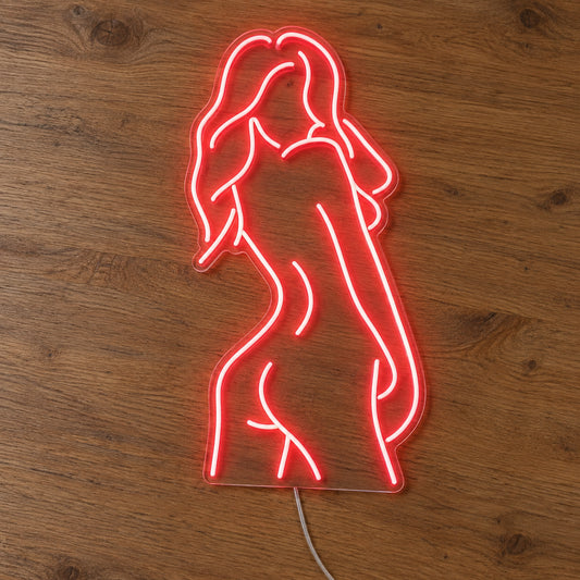Nude Woman LED Neon Sign in red, featuring outline of a woman's figure on a wooden surface.