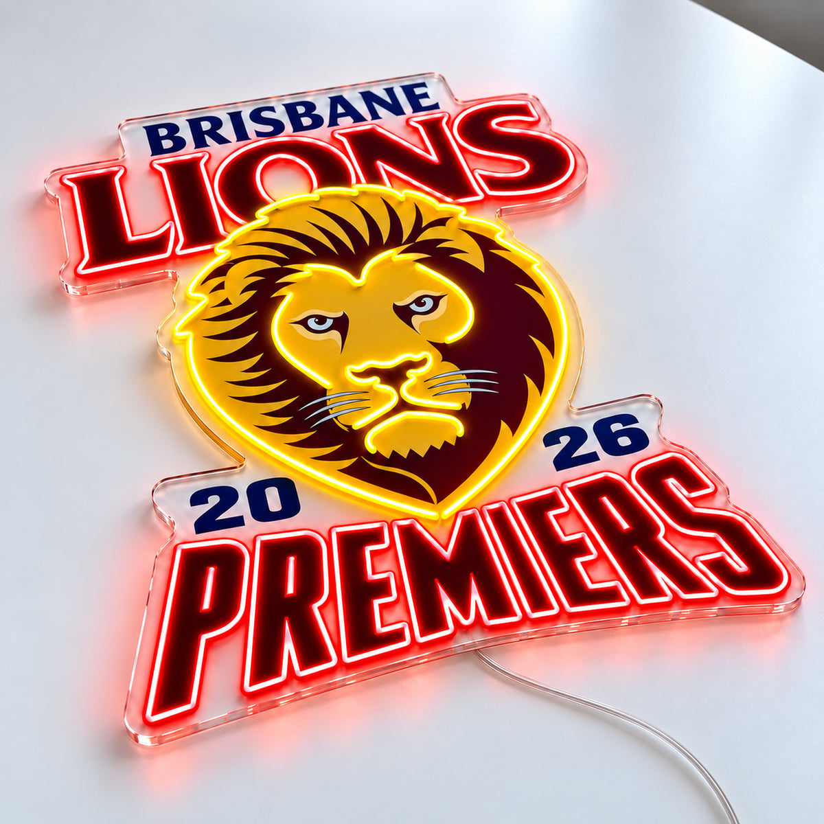 Brisbane Lions Neon Sign - Premiers 2026 with red and yellow LED neon on a white surface, angle view