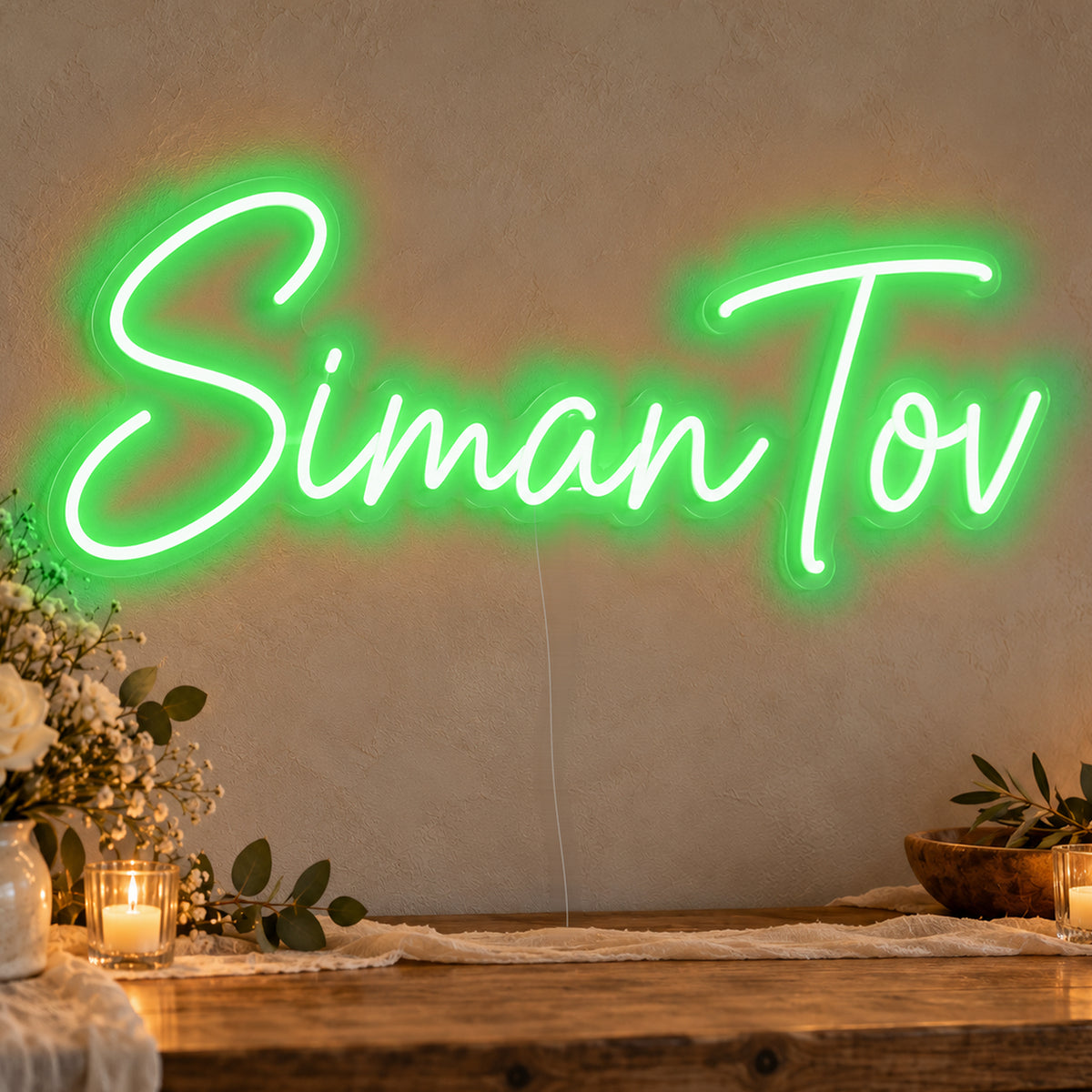 Siman Tov Neon Sign in green LED neon on clear acrylic, angled view