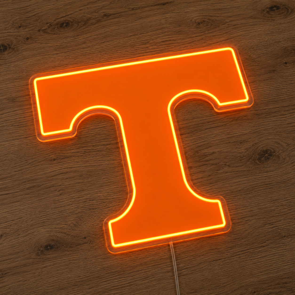 Close up of the Tennessee Volunteers Power T LED neon sign lit in Vol orange