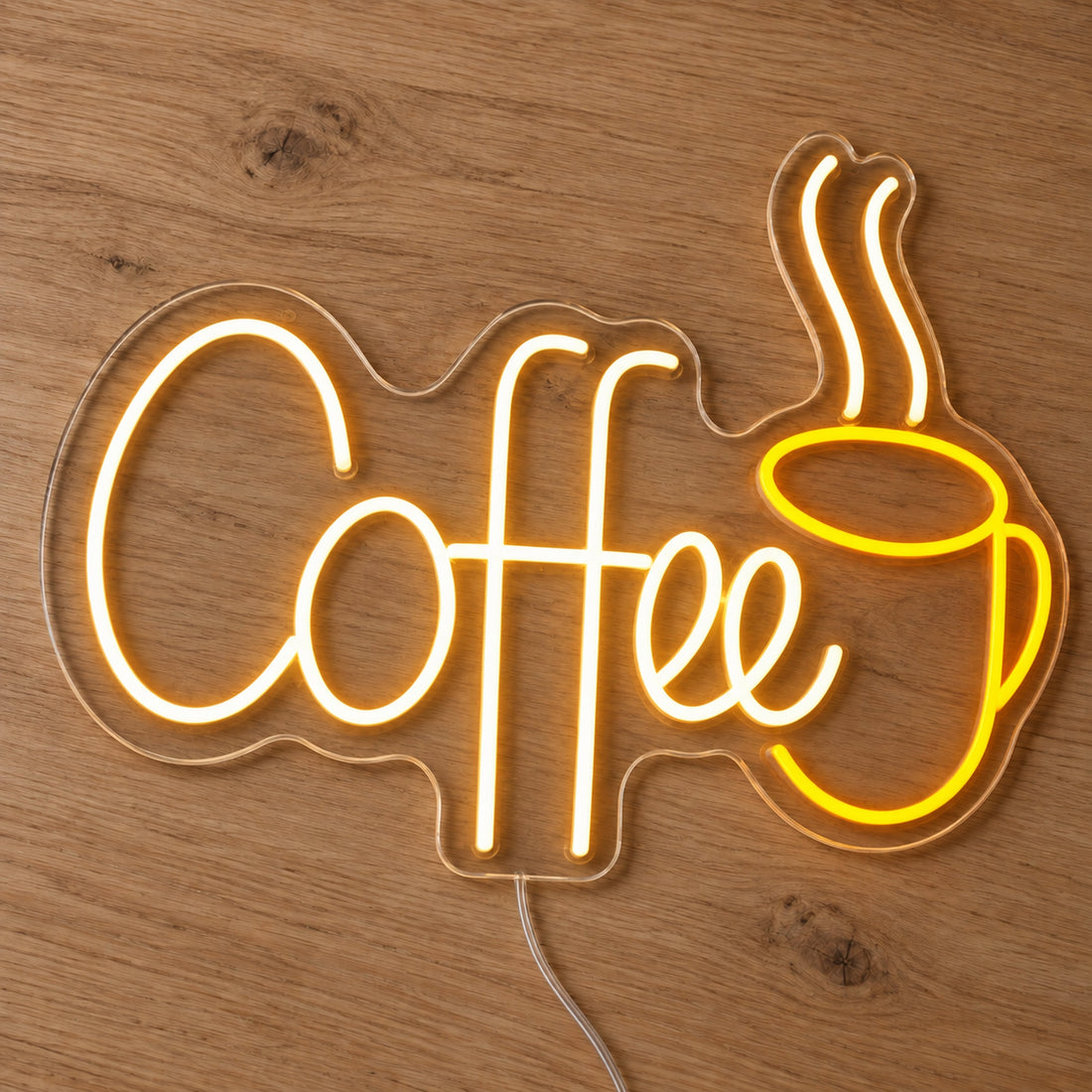 Coffee LED Neon Sign - Cafe and Business Sign in warm white and yellow, featuring Coffee lettering beside a steaming cup outline on a wooden surface.