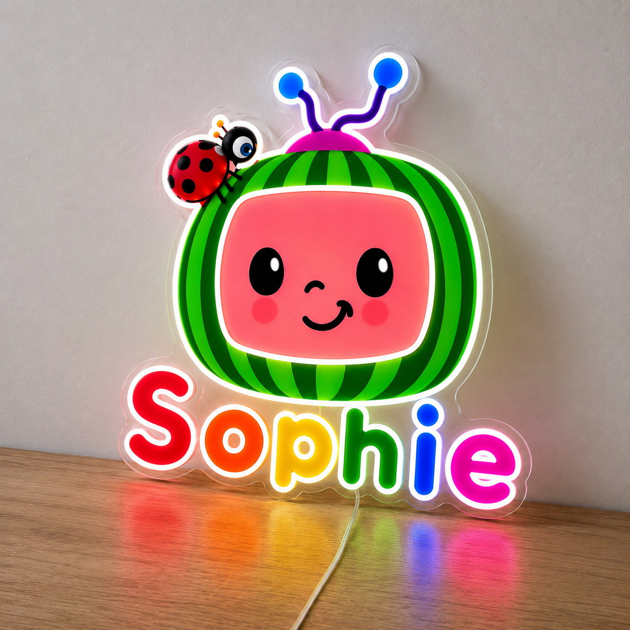 Personalised CoComelon neon sign with a child's name on clear acrylic