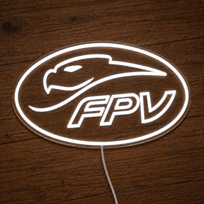 FPV Ford Performance Vehicles LED Neon Sign in warm white, featuring oval FPV logo with a bird-head outline on a wooden surface.