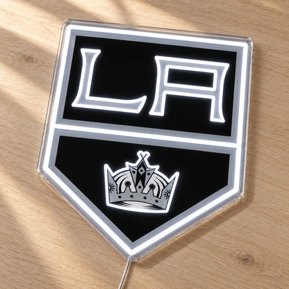 Los Angeles Kings LED Neon Sign, featuring team logo displayed on a wooden surface.