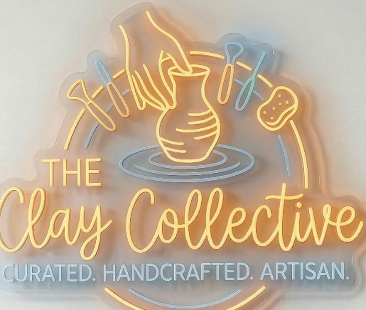 Neon sign for 'The Clay Collective' with clay-making imagery studio on a white background