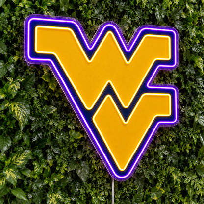 West Virginia Mountaineers LED Neon Sign, featuring team logo displayed on a green foliage wall.