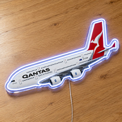 Airbus A380 Qantas Neon Sign with printed aircraft details and an illuminated LED outline on clear acrylic, shown on a wooden surface, registration VH-OQK