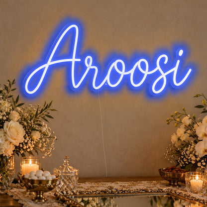 Aroosi Neon Sign in blue LED neon on clear acrylic, angled view