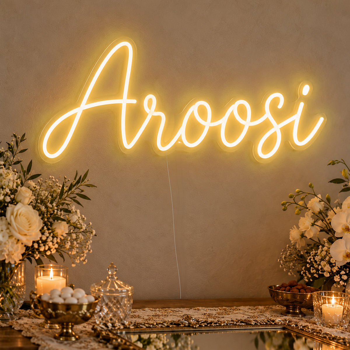 Aroosi Neon Sign in gold LED neon on clear acrylic, angled view