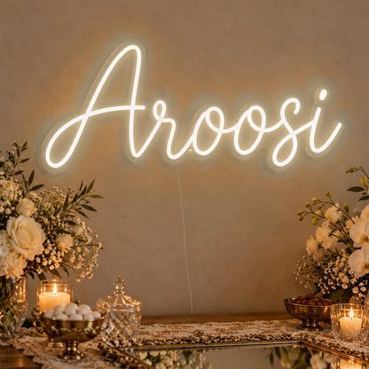 Aroosi Neon Sign in warm white LED neon on clear acrylic, angled view