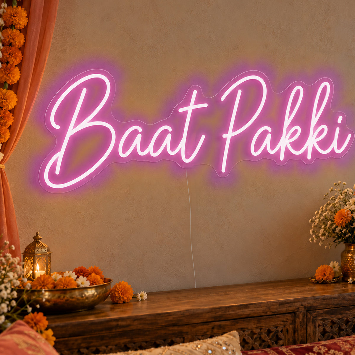 Baat Pakki Neon Sign in pink LED neon on clear acrylic, angled view