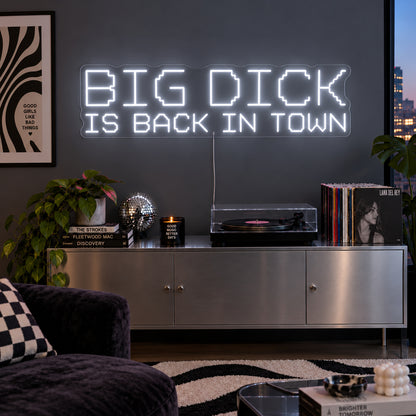 Big Dick Is Back In Town Neon Sign, RGB colour-changing option shown in white above a record player and metal sideboard.