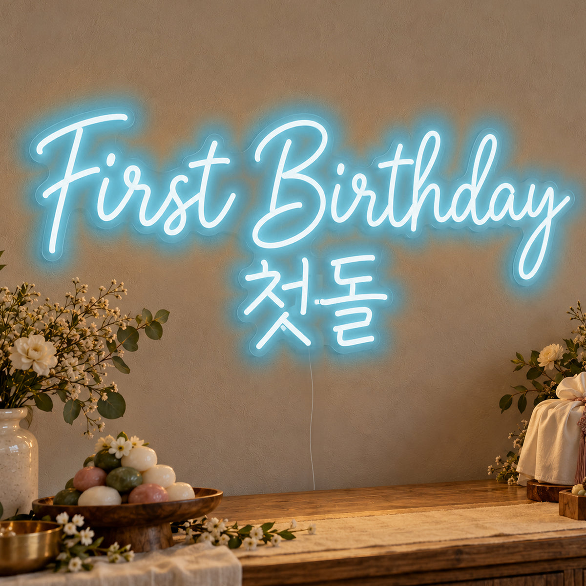 First Birthday English & Korean Neon Sign in ice blue LED neon on clear acrylic, angled view