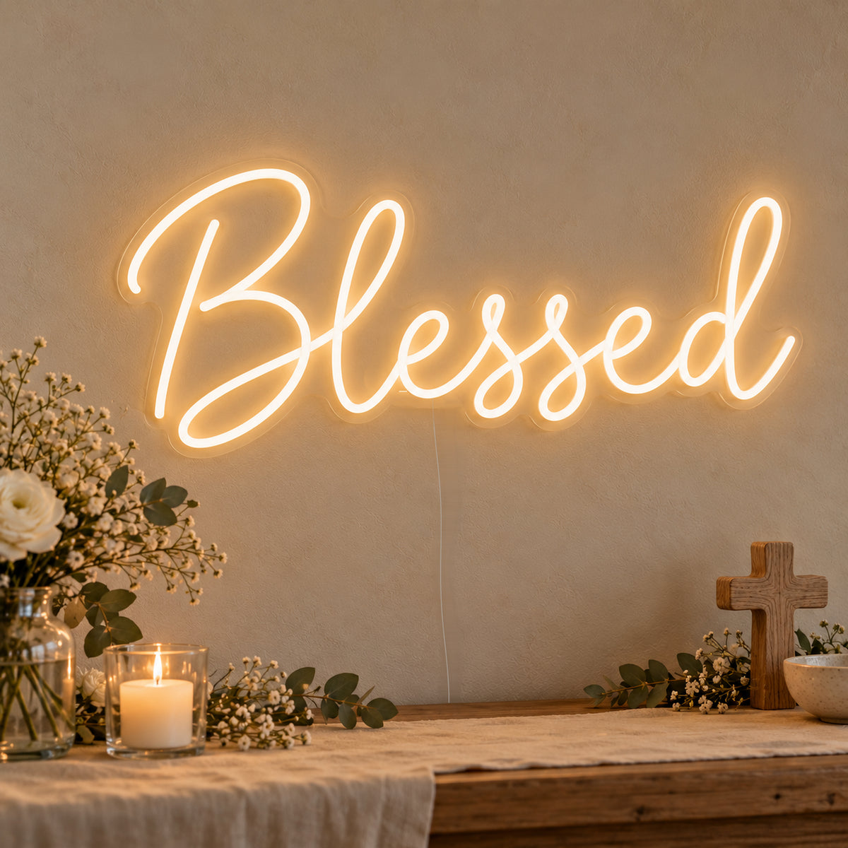 Blessed Neon Sign on clear cut-to-shape acrylic, illuminated on a wall in a styled celebration setting