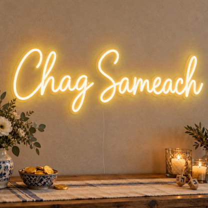 Chag Sameach Neon Sign in gold LED neon on clear acrylic, angled view