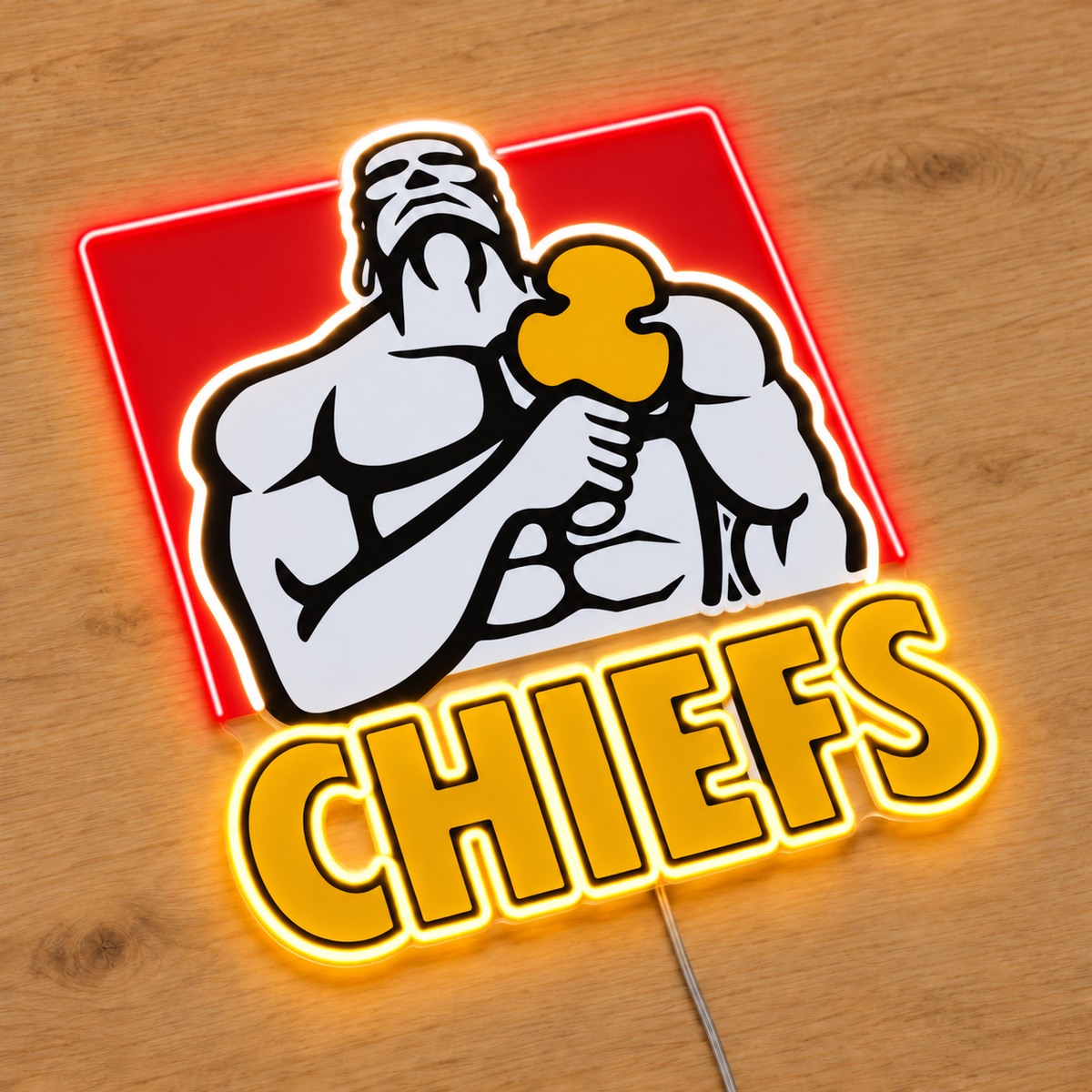 Chiefs neon sign with a red neon frame on three sides and UV printed warrior details on wood, angled view