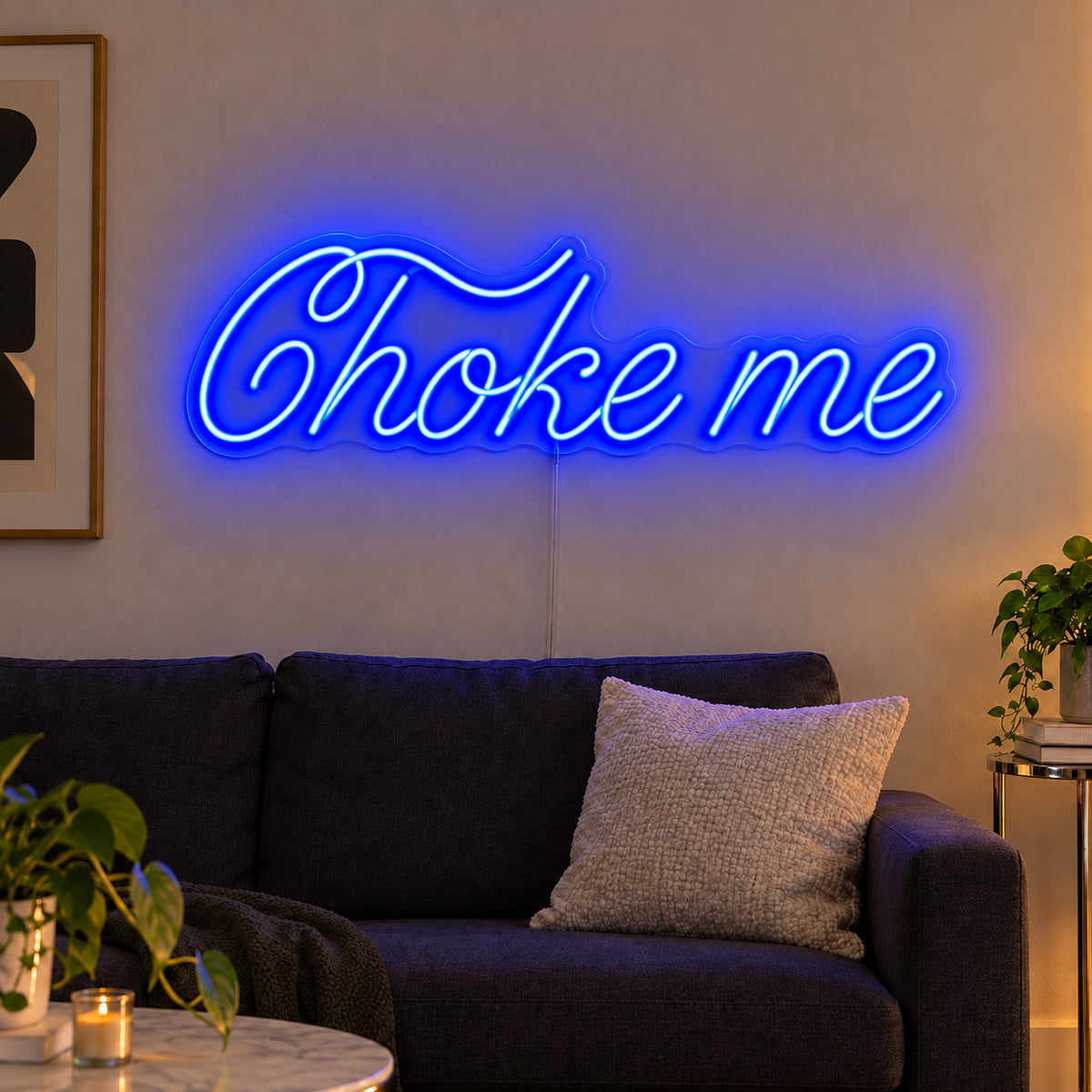Choke Me Neon Sign glowing blue above a charcoal sofa.