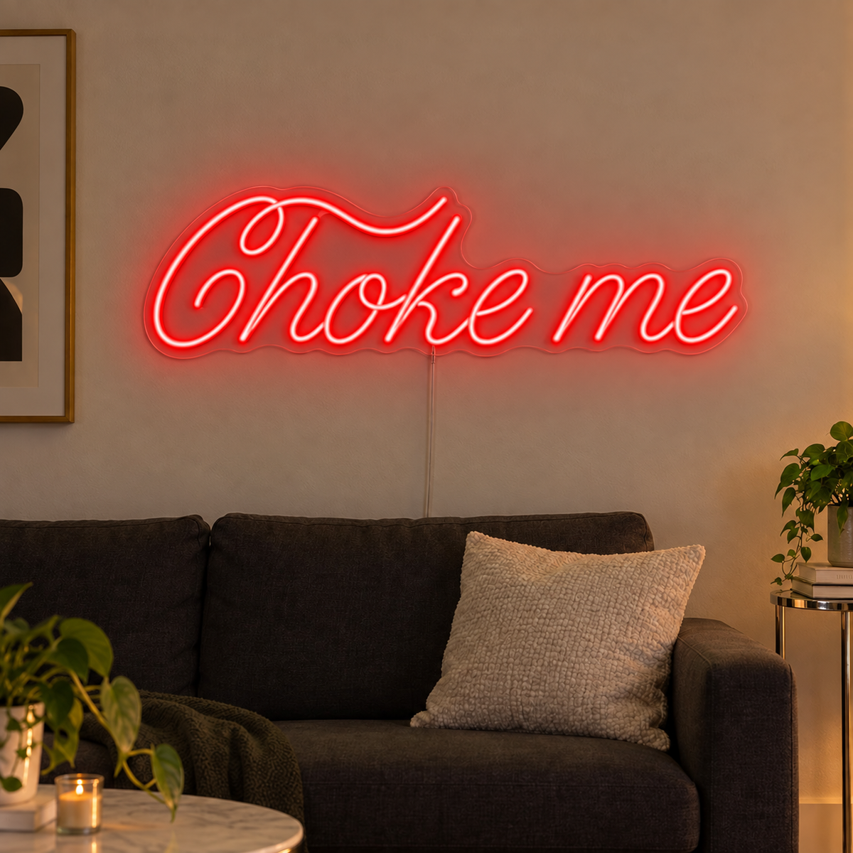 Choke Me Neon Sign in red above a charcoal sofa.