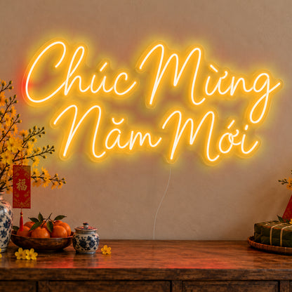 Chúc Mừng Năm Mới Neon Sign in gold LED neon on clear acrylic, angled view
