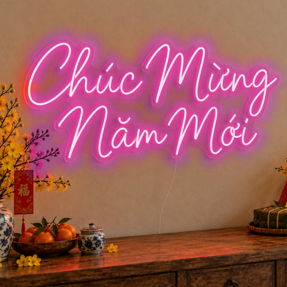 Chúc Mừng Năm Mới Neon Sign in pink LED neon on clear acrylic, angled view