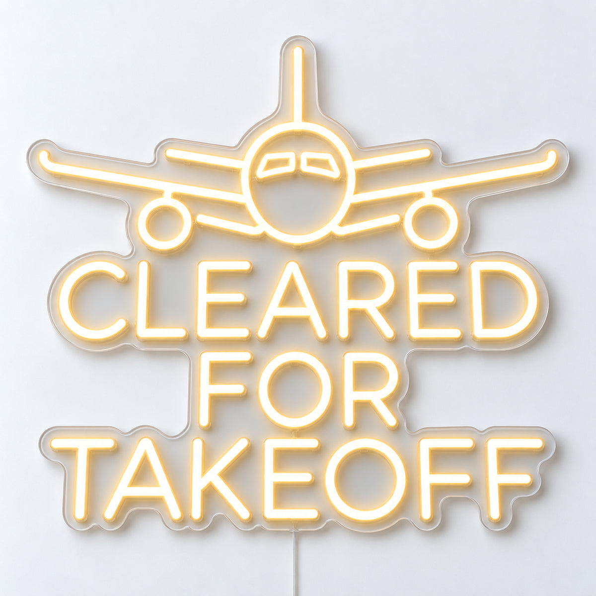 Cleared for Takeoff Neon Sign, featuring Cleared for Takeoff lettering beneath an aircraft motif, on a single clear acrylic backing displayed on a white surface.