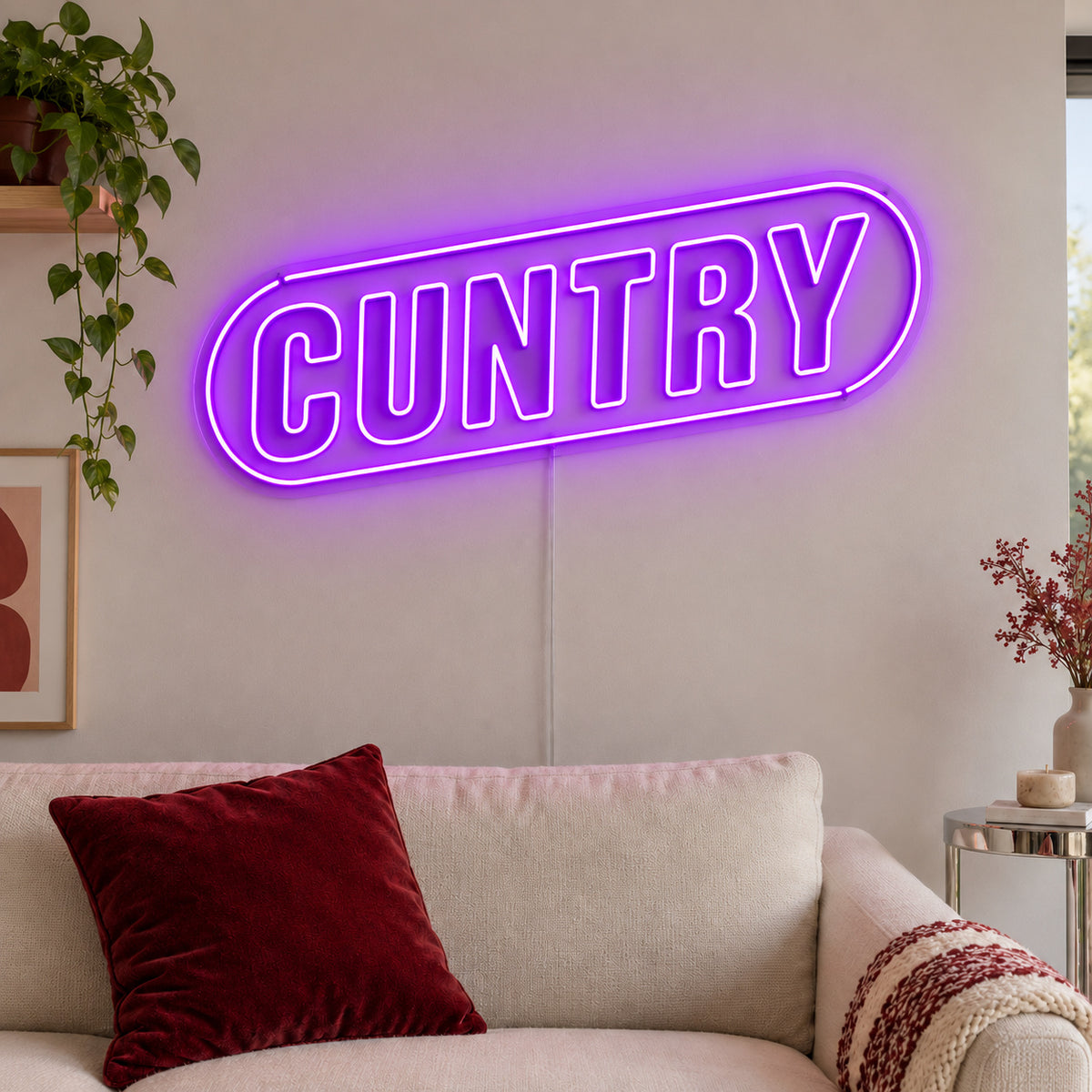 Cuntry Neon Sign with purple lighting, displayed inside a rounded border above a cream sofa.
