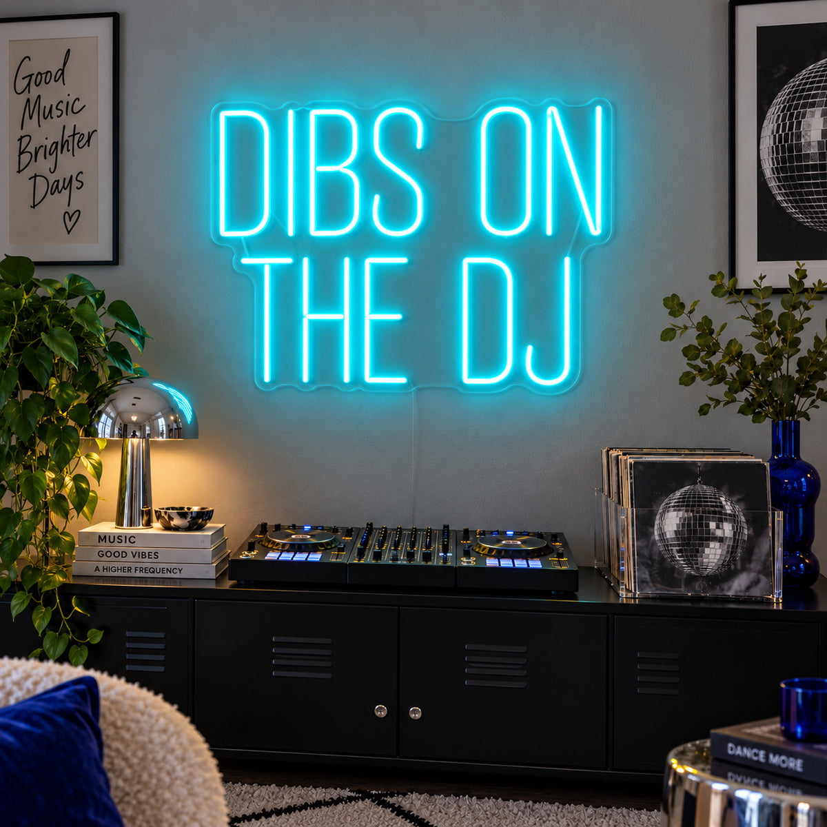 Ice Blue version of the Dibs On The DJ Neon Sign, shown above a home DJ setup.