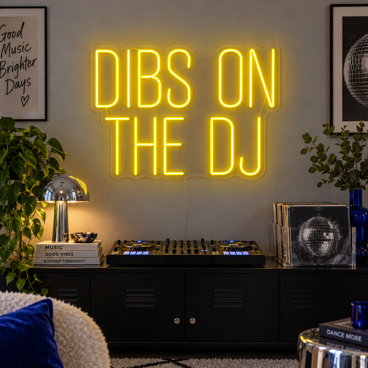 Dibs On The DJ Neon Sign in yellow above a home DJ setup.