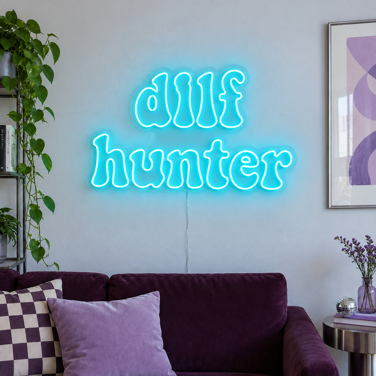 Ice Blue version of the DILF Hunter Neon Sign, shown above a sofa with purple cushions.