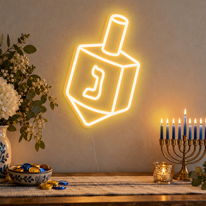 Dreidel Neon Sign in gold LED neon on clear acrylic, angled view