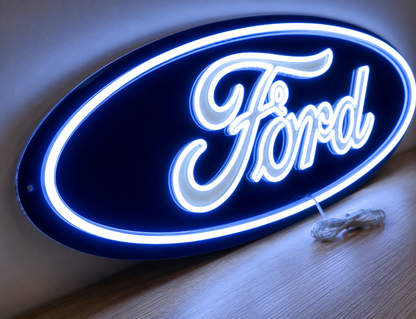 Close-up of Ford oval LED neon light sign showing glowing script lettering