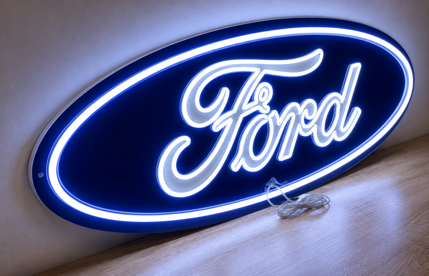 Ford oval neon sign glowing blue and white, angled against a wall