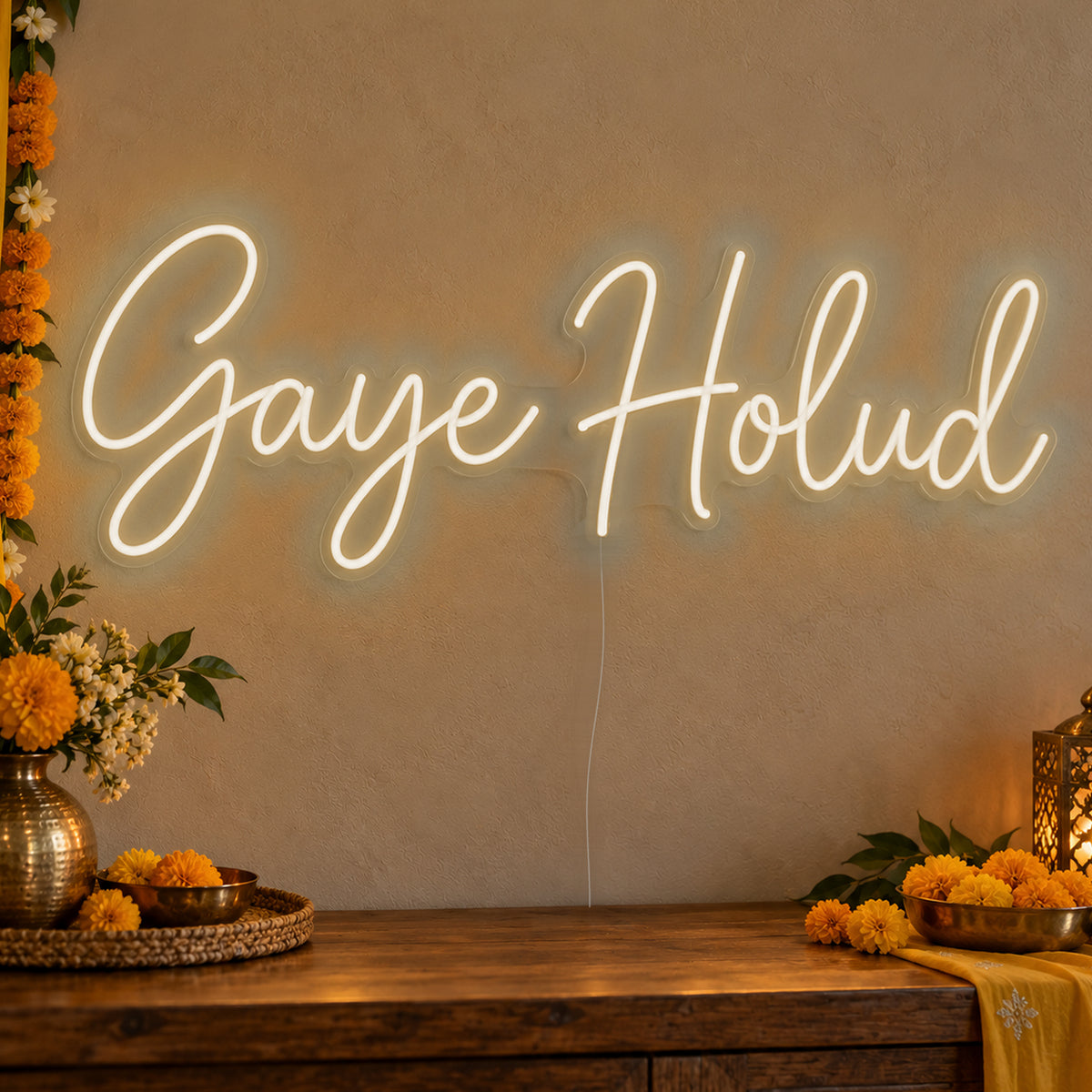 Gaye Holud Neon Sign in warm white LED neon on clear acrylic, angled view