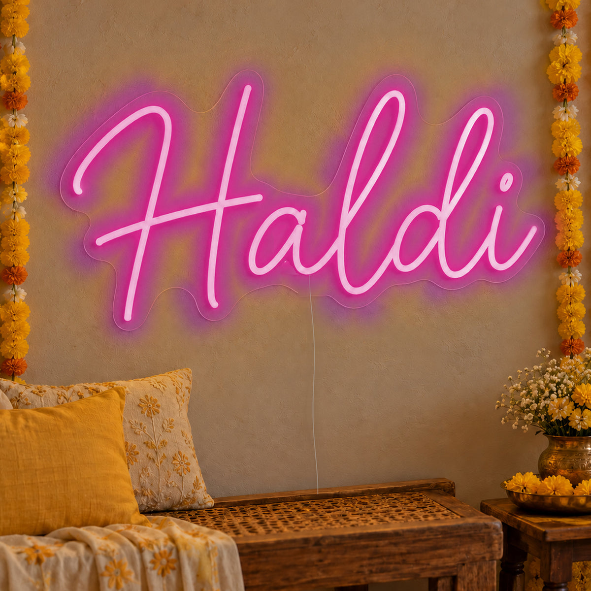 Haldi Neon Sign in pink LED neon on clear acrylic, angled view