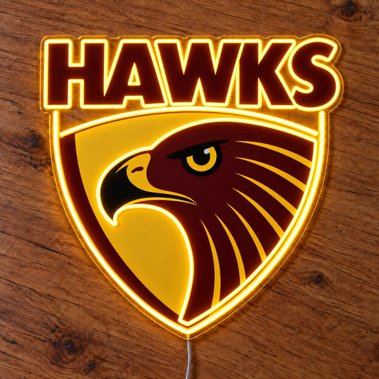 Hawthorn Hawks LED Neon Sign glowing on a wooden surface