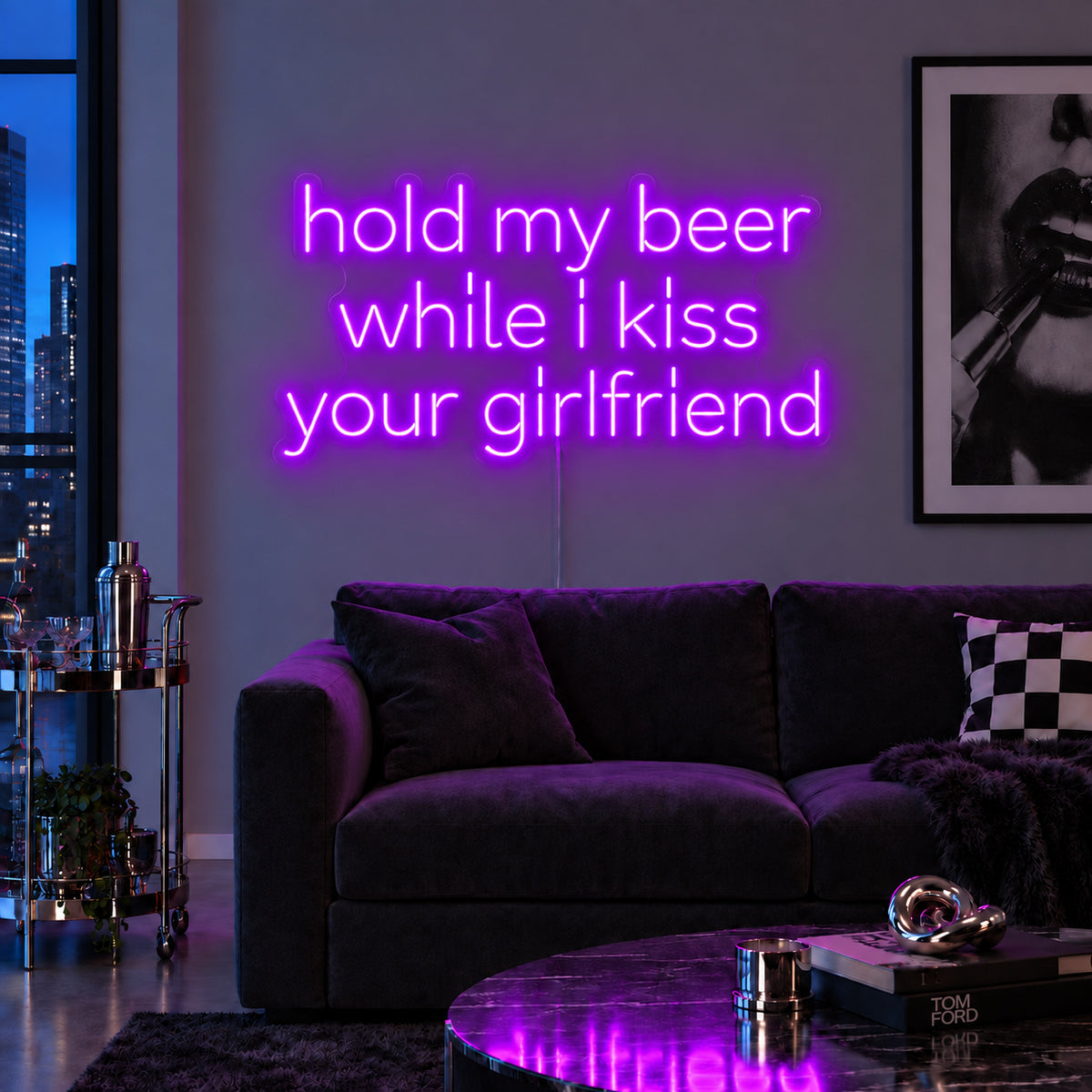 Hold My Beer While I Kiss Your Girlfriend Neon Sign with purple lighting, displayed above a burgundy sofa.