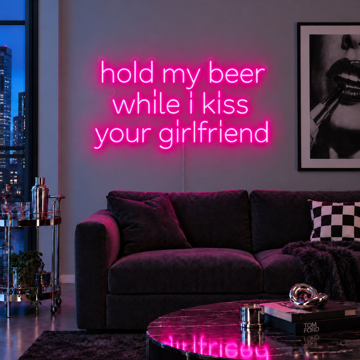 Rose Red version of the Hold My Beer While I Kiss Your Girlfriend Neon Sign, shown above a burgundy sofa.