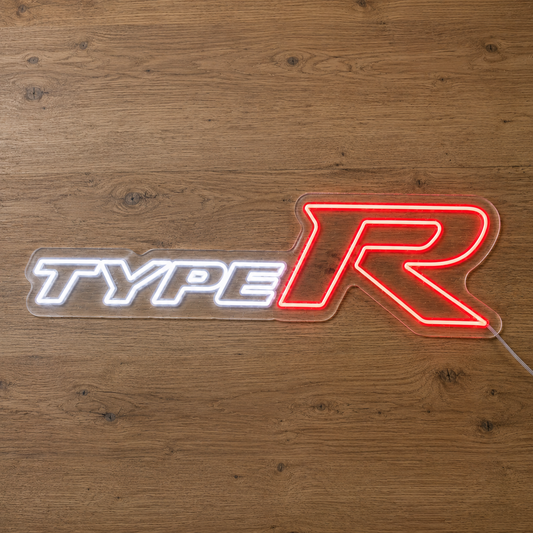 Honda Type R LED neon sign with white lettering and red R glowing on a timber wall
