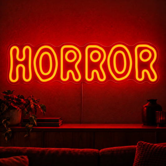 Horror Rounded Letters Neon Sign featuring the word Horror in rounded orange outline letters, displayed on a dark wall above a wooden sideboard.
