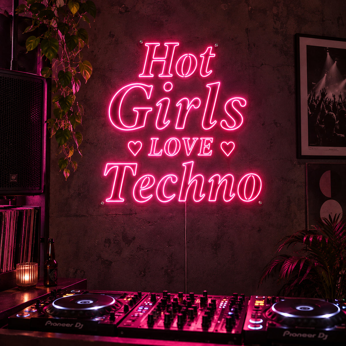 Hot Girls Love Techno Neon Sign in rose red with heart details above a DJ setup.