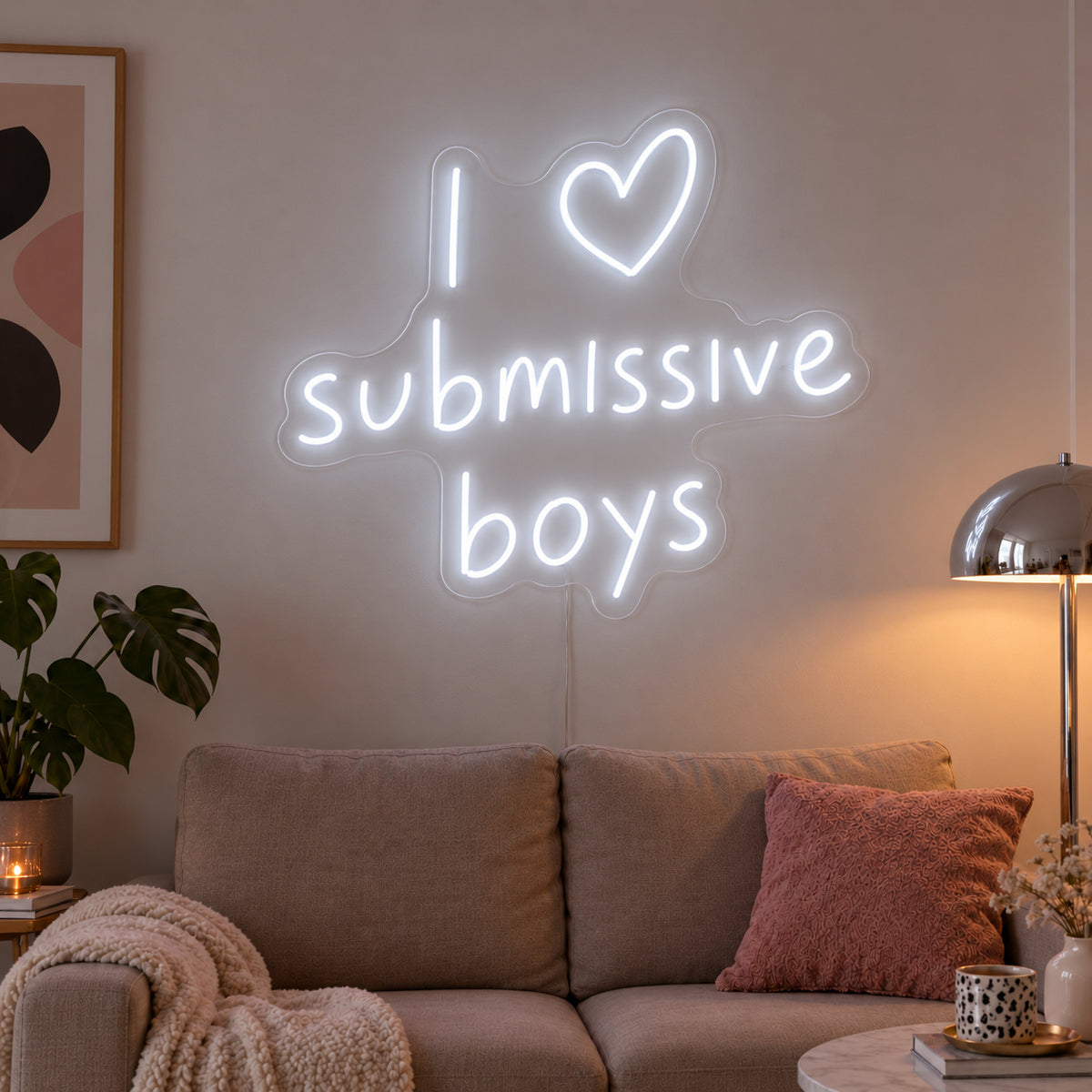 I Love Submissive Boys Neon Sign glowing white above a neutral sofa.