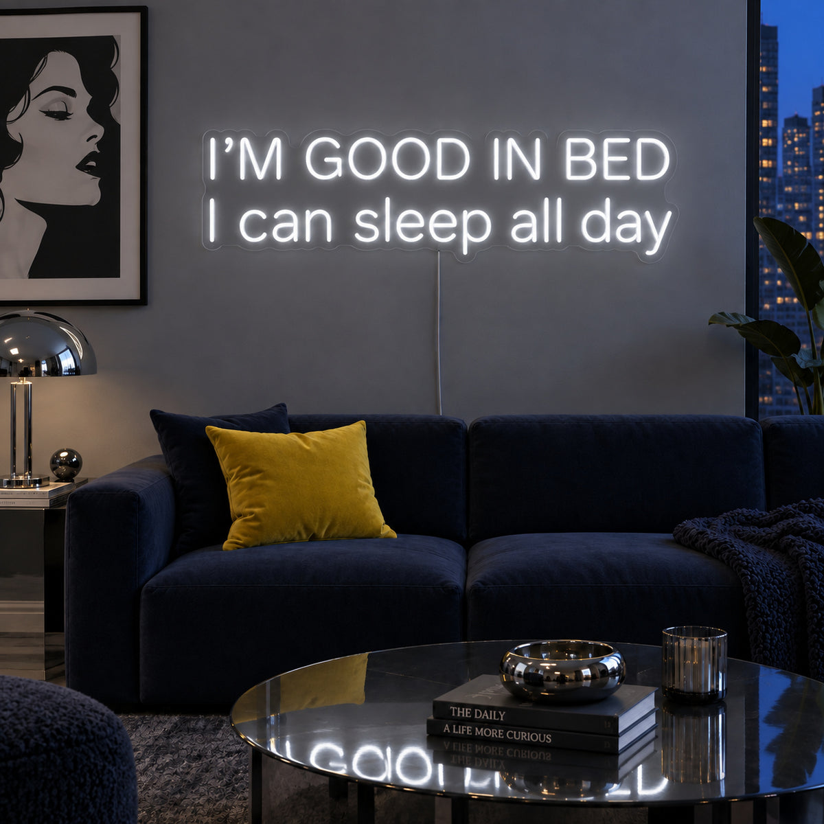 I'm Good In Bed I Can Sleep All Day Neon Sign, RGB colour-changing option shown in white above a navy sofa.