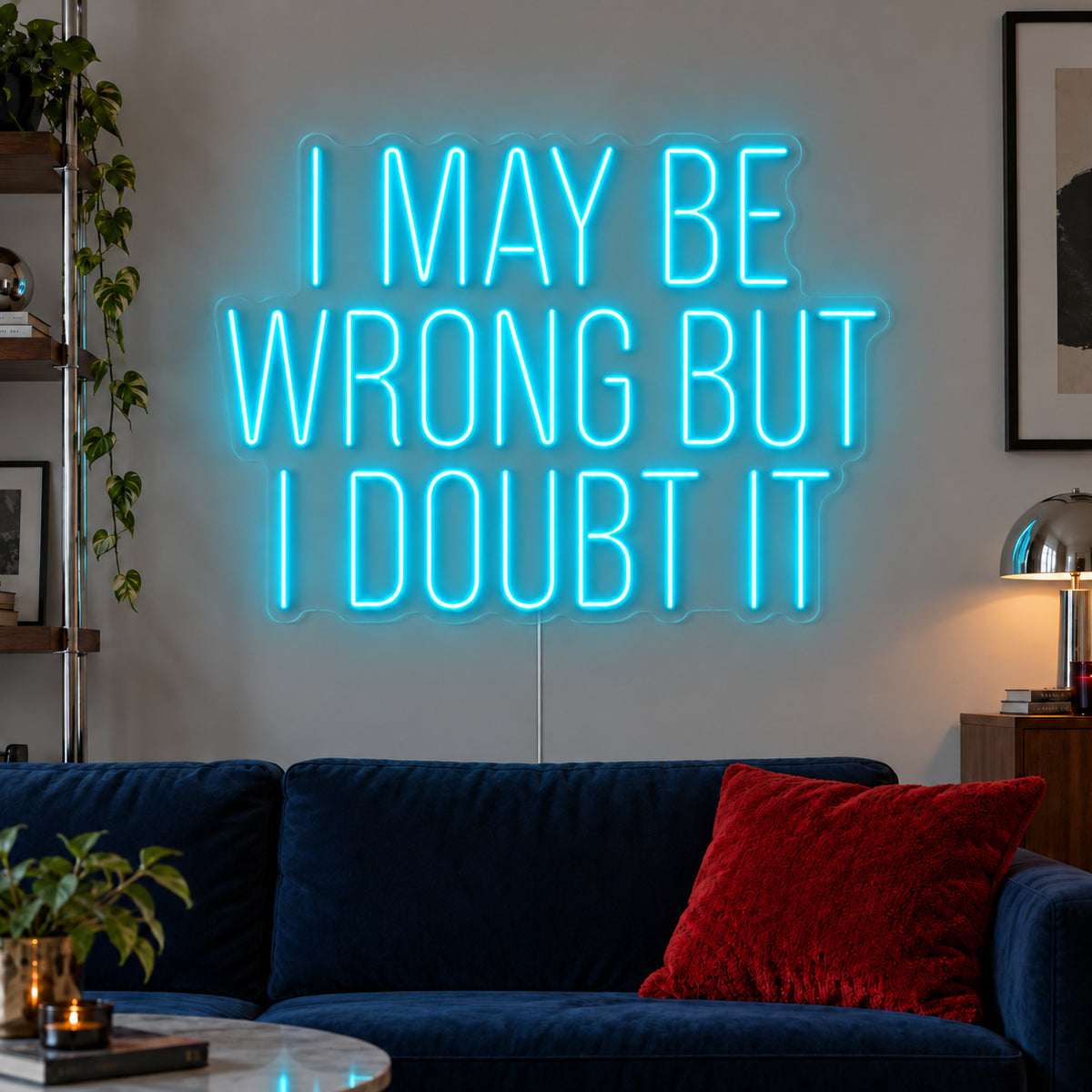 Ice Blue version of the I May Be Wrong But I Doubt It Neon Sign, shown above a dark blue sofa.