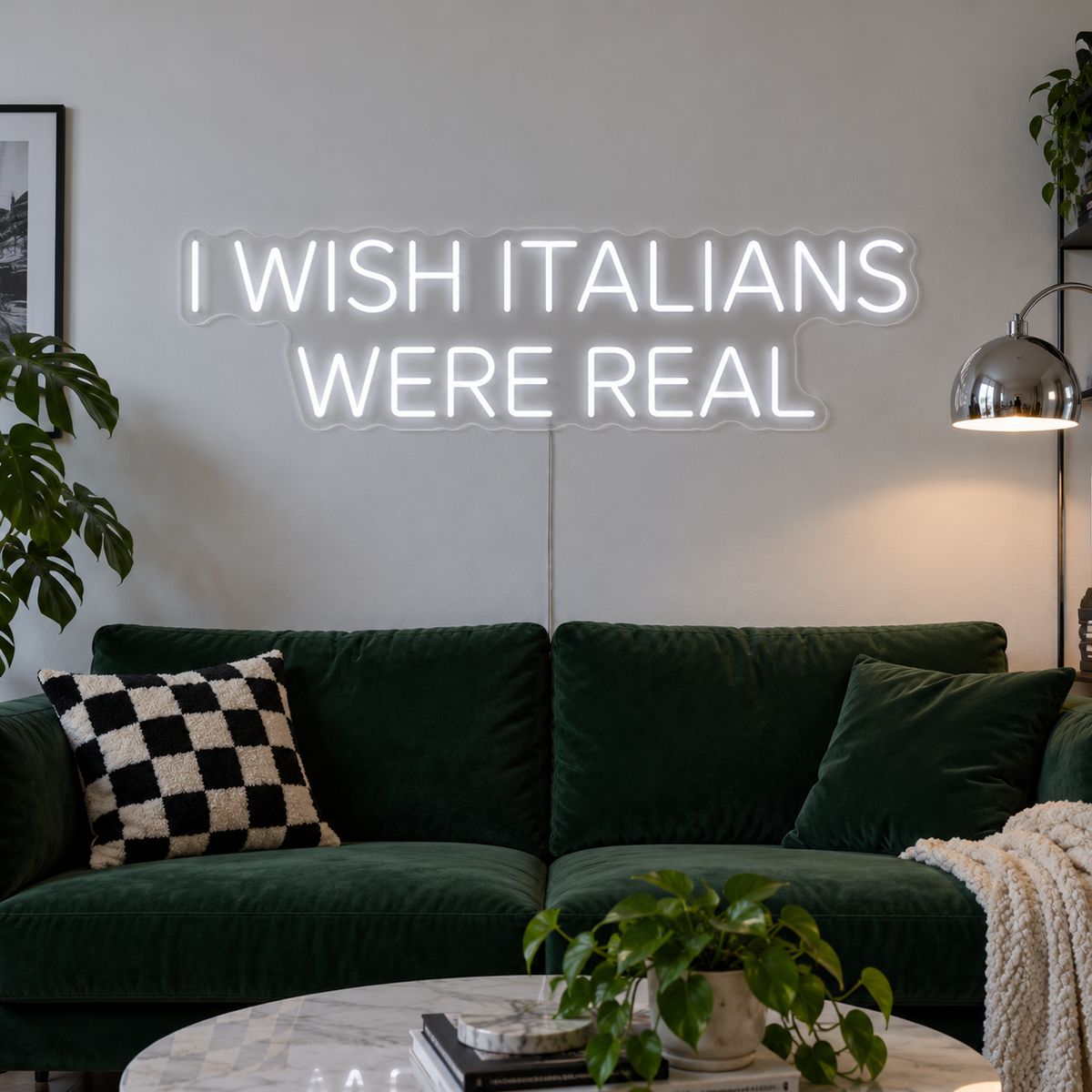 I Wish Italians Were Real Neon Sign in white above a green sofa.
