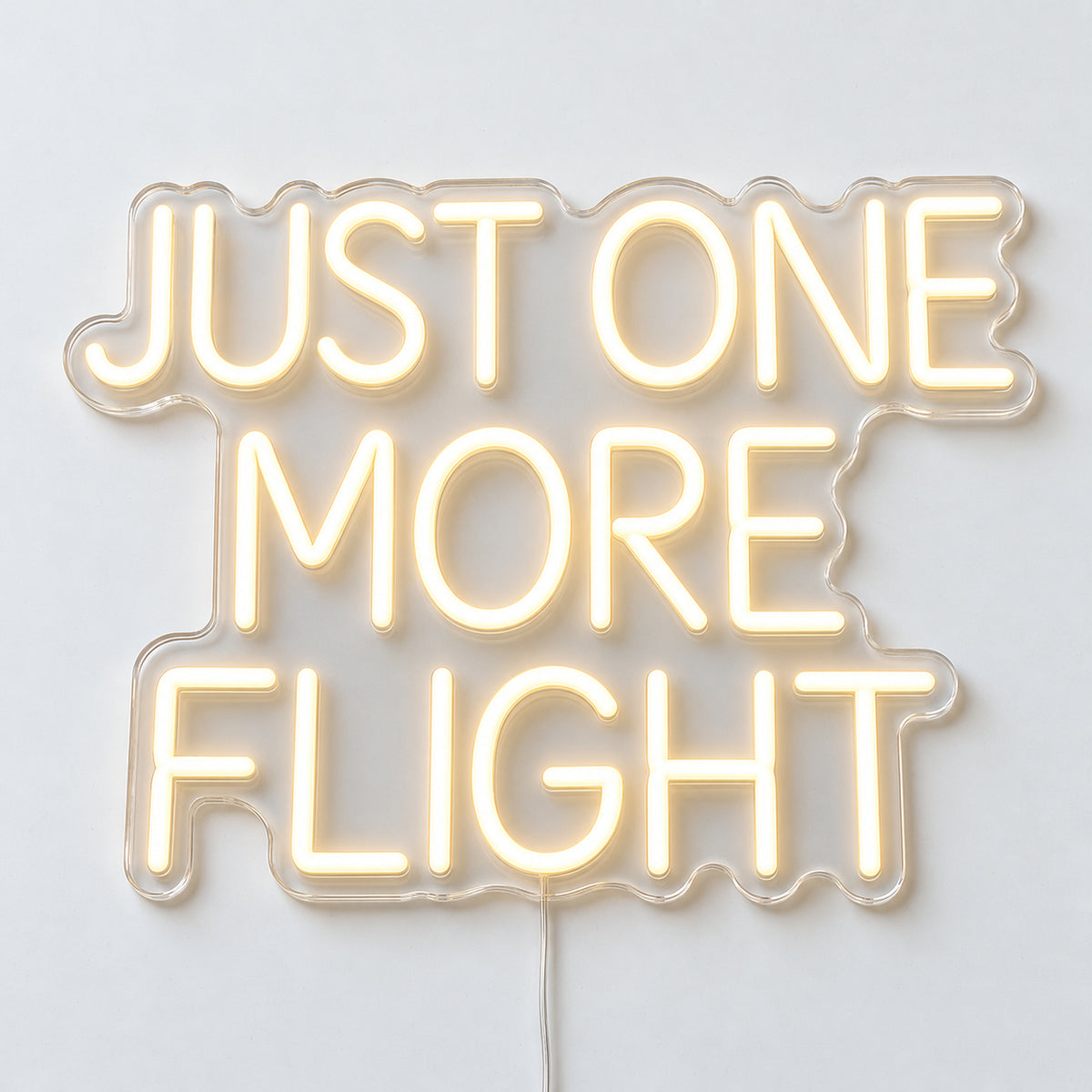 Just One More Flight Neon Sign, featuring Just One More Flight lettering for aviation enthusiasts, on a single clear acrylic backing displayed on a white surface.