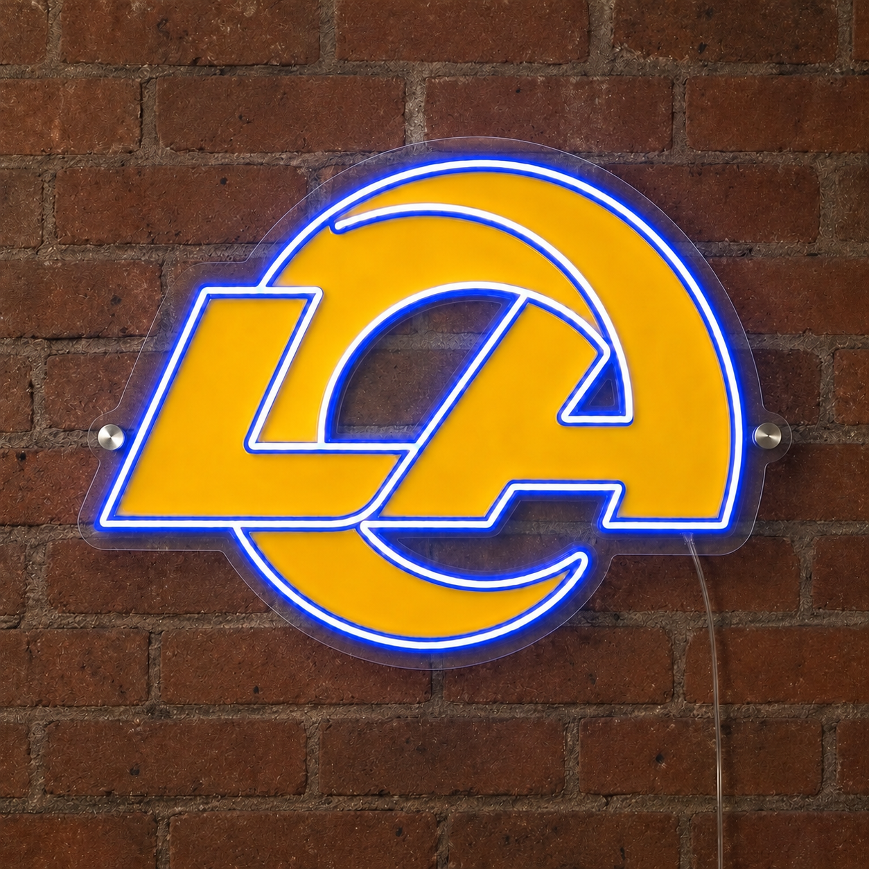 LA Rams neon sign glowing on a brick wall