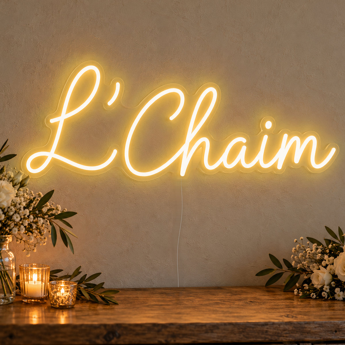 L’Chaim Neon Sign in gold LED neon on clear acrylic, angled view