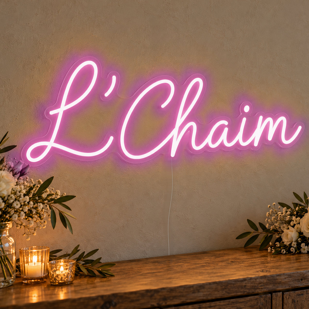 L’Chaim Neon Sign in pink LED neon on clear acrylic, angled view