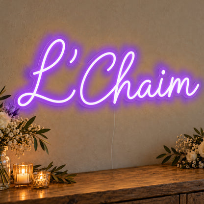 L’Chaim Neon Sign in purple LED neon on clear acrylic, angled view